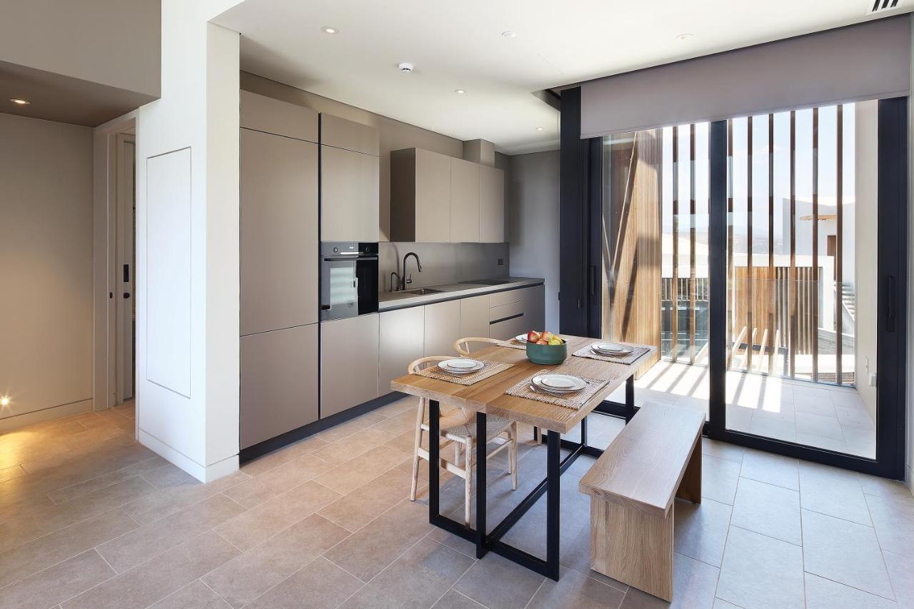 Minthis Resort Tsadha Exterior foto The kitchen and dining area of a typical apartment