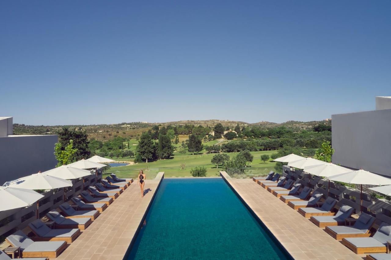 Minthis Resort Tsadha Exterior foto The pool at the hotel
