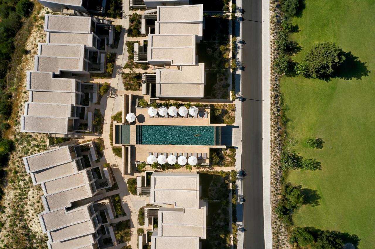 Minthis Resort Tsadha Exterior foto Aerial view of the hotel