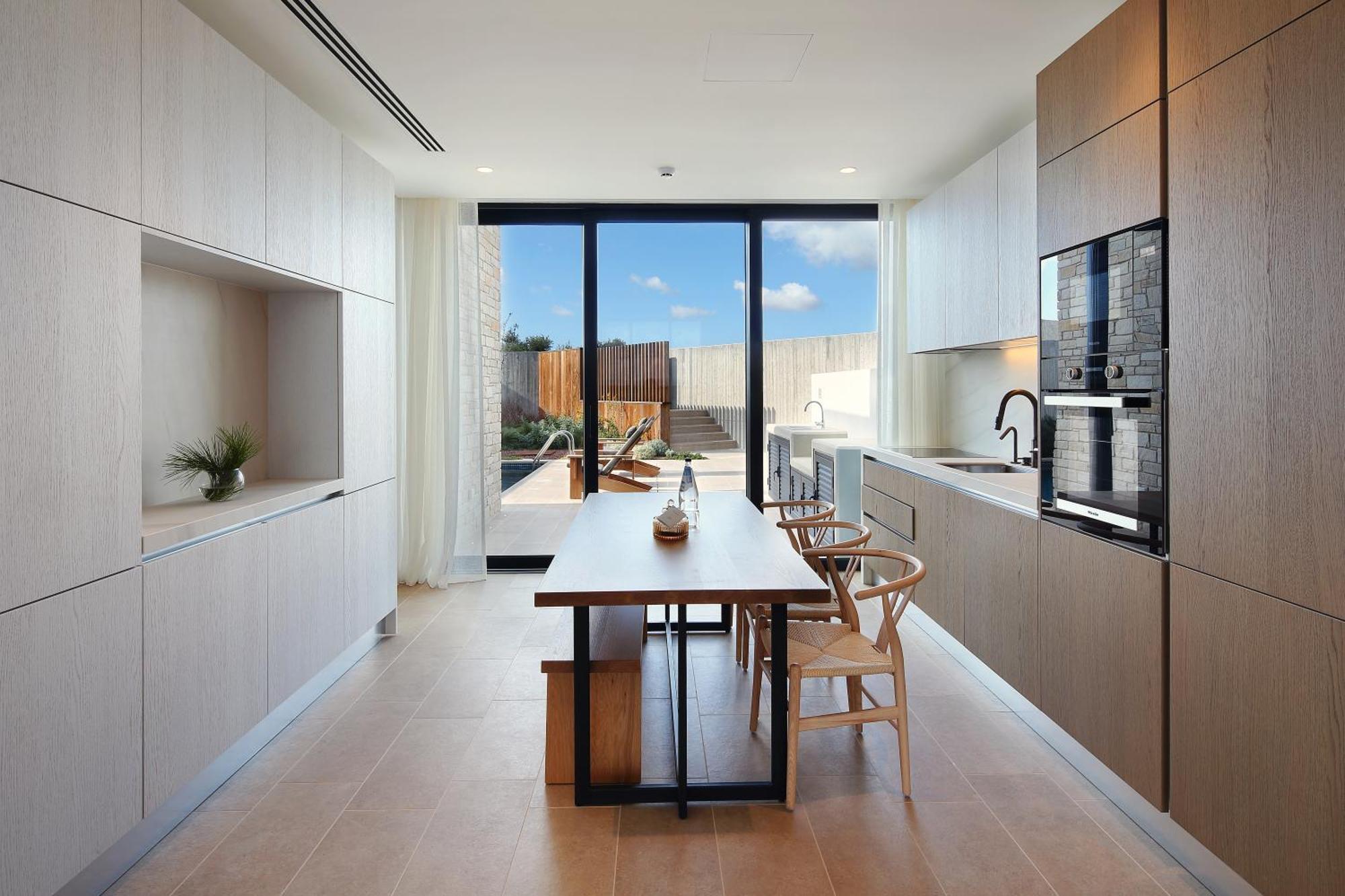 Minthis Resort Tsadha Exterior foto A kitchen in a typical apartment